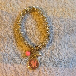 Silver Charm Bracelet with Pink Accent.